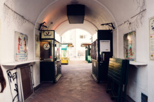 Historic Art Nouveau architecture framing Naschmarkt stalls.