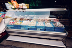 Tempting display of traditional Viennese sweets and Turkish delights at Naschmarkt, where colorful lokum, candied fruits, and handmade chocolates create an artful composition.