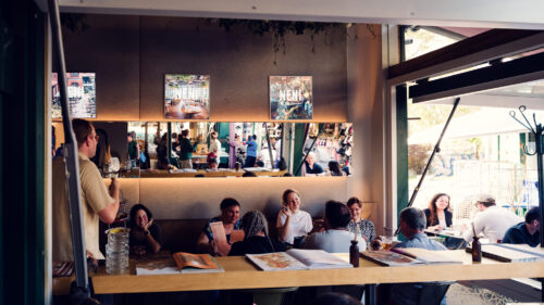 Intimate corner seating on NENI's terrace overlooking bustling Naschmarkt.