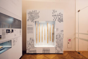 Intricately engraved bamboo tubes at Weltmuseum Vienna.