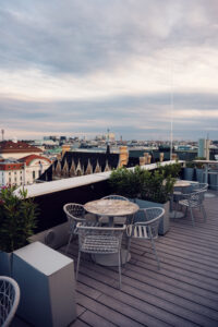 Atmosphere Rooftop Bar's intimate two-person tables positioned for optimal sunset photography angles.