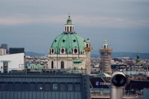 Vienna skyline view from Atmosphere Rooftop Bar showing St. Charles's Church.