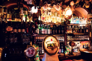 Original wooden bar at Bockshorn, showcasing classic Irish pub craftsmanship in Vienna's heart.