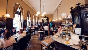 Traditional marble-topped tables at Café Sperl showcasing classic coffee house culture.