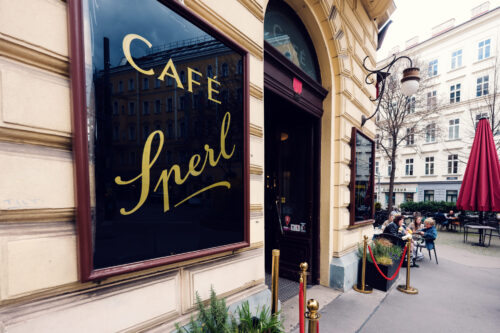 Classic gold-lettered signage at Café Sperl displaying timeless 'CAFE SPERL' typography against traditional facade.