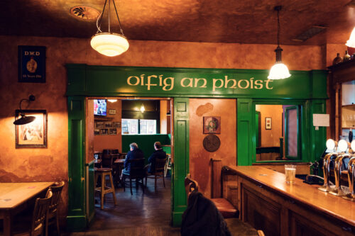 Historic 'Oifig an Phoist' sign at Flanagans Irish Pub Vienna, where traditional Gaelic lettering adds authentic Irish character.