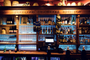 Premium whiskey collection at Flanagans Irish Pub Vienna, where carefully curated Irish, Scottish, and international spirits create impressive bar display.