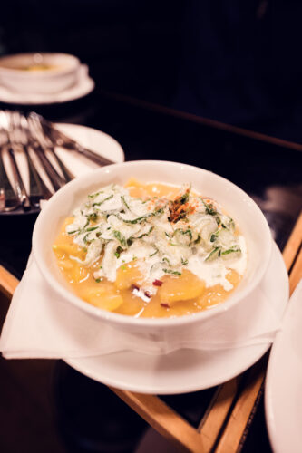 Traditional Kartoffelsalat at Gasthaus Pöschl, featuring hand-cut potatoes in classic Viennese dressing.
