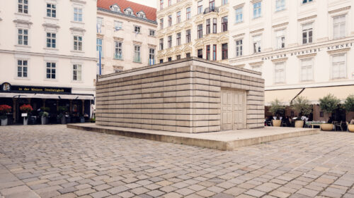 Wide-angle view of Judenplatz (Jewish Square) Vienna showing spatial relationship between monuments and historic buildings.