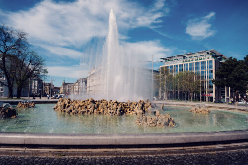 Close-up of water jets at Vienna's Hochstrahlbrunnen fountain on Schwarzenbergplatz, showcasing the technical engineering of this 19th century monument.