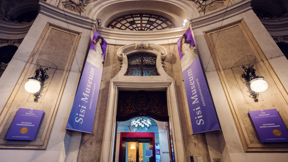 Historic entrance gate to the Sisi Museum section of Hofburg Palace Vienna.