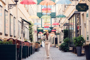 Adriana under colorful umbrella canopy at Sünnhof.