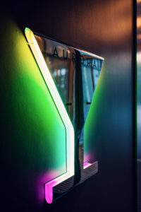 Modern cocktail glass wall art at Aurora Rooftop Bar Vienna.