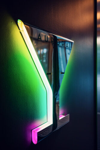 Modern cocktail glass wall art at Aurora Rooftop Bar Vienna.