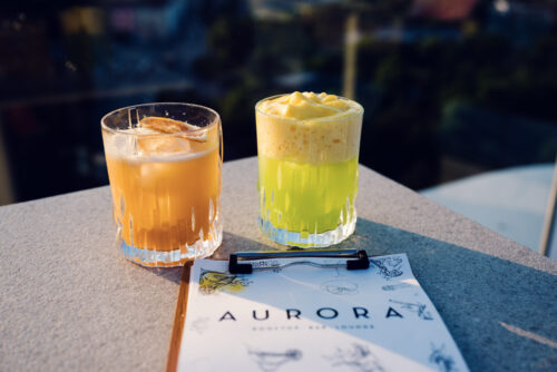 Delicious cocktails at Aurora Rooftop Bar Vienna Austria, elevated cocktail experience with modern rooftop terrace atmosphere and panoramic Vienna city views.