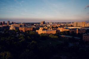 Aurora Rooftop Bar sunset vista Vienna Austria, panoramic evening cityscape with golden hour lighting and elevated views over Vienna's historic districts.