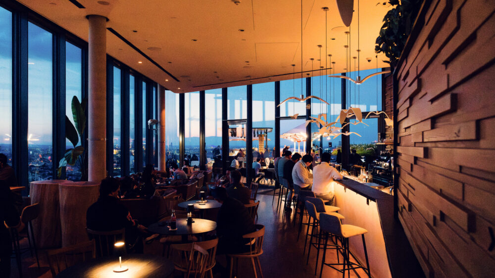 Interior of Aurora Rooftop Bar Vienna Austria, modern cocktail lounge design with contemporary furnishings and elevated bar atmosphere in Vienna city center.