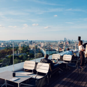 Rooftop terrace at Aurora Bar Vienna, outdoor cocktail area with Vienna skyline views and contemporary bar atmosphere.