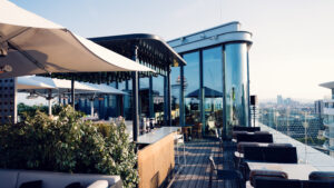 Aurora Rooftop Bar Vienna Austria, elevated cocktail lounge with panoramic city views and modern rooftop terrace design.