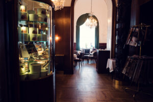 Interior view of Café Landtmann showing original mirrors and wood-paneled walls from 1873.