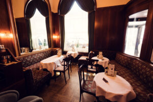 Viennese Coffeehouse Culture with Café Landtmann's grand interior featuring original 1873 design elements.