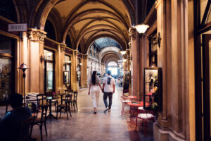Adriana and Mario at Ferstl Passage Vienna with classical Viennese design elements.