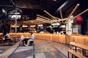 Gleis//Garten Vienna, Austria's first food market housed in a former railway carriage shed, featuring 9 different restaurants, 2 bars, and an on-site brewery Vienna Kraft.