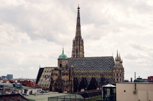 View from Lamee Rooftop Bar Vienna showing St. Stephen's Cathedral's iconic 111-meter-long glazed tile roof with its distinctive zigzag pattern.