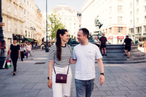 Adriana and Mario at Neuer Markt Vienna with Donnerbrunnen fountain in background.