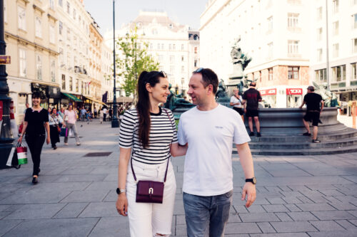 Adriana and Mario at Neuer Markt Vienna with Donnerbrunnen fountain in background.