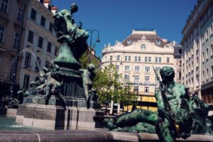 Donnerbrunnen Providence Fountain at Neuer Markt close-up detail Vienna, baroque sculpture by Georg Raphael Donner with intricate stonework and classical figures.