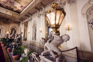 Palais Kinsky Vienna baroque interior marble statues with classical sculptural details.