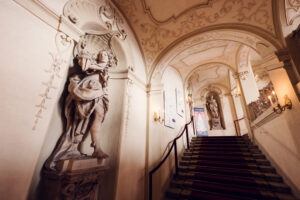 Palais Kinsky Vienna baroque grand staircase with ornate marble steps.
