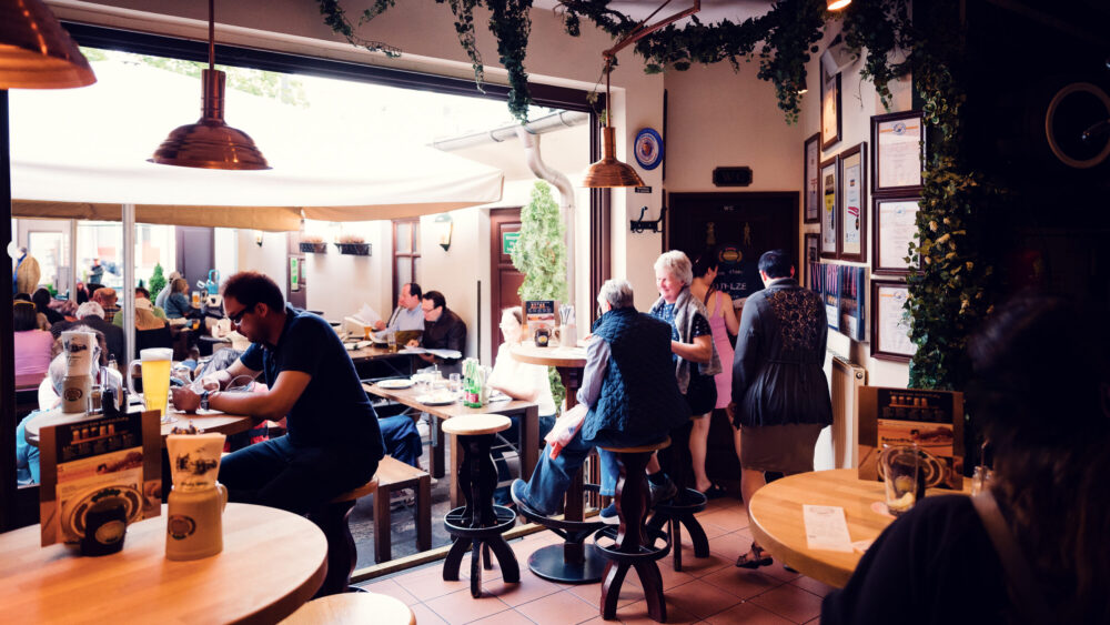 Salm Bräu Vienna interior dining area with rustic wooden tables, traditional brewery ambiance and authentic Austrian beer hall design.