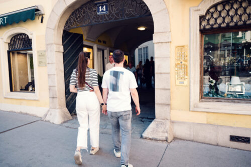 Adriana and Mario walking through Habsburger Gasse Vienna, historic Habsburg street with traditional Austrian architecture in First District.