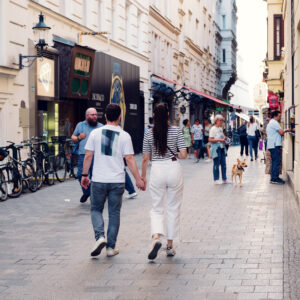 Adriana and Mario walking through Vienna First District Innere Stadt historic city center streets.