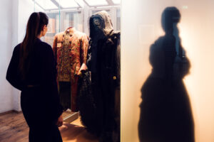 Adriana viewing historic period clothing display at Mozarthaus.