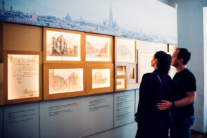 Mozarthaus Vienna information panels with multilingual Mozart biography details.