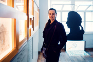 Adriana viewing Mozart exhibition display at Mozarthaus.