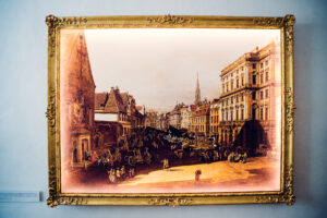 Historic Vienna cityscape painting display at Mozarthaus.