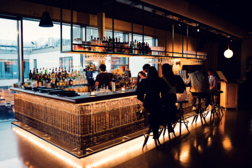 Stylish bar counter with Middle Eastern inspired design at Neni am Prater.