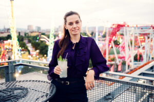 Adriana enjoying fresh lemonade on outdoor terrace at Neni am Prater.