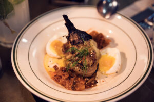 Traditional Middle Eastern egg dish with fresh herbs at Neni am Prater.