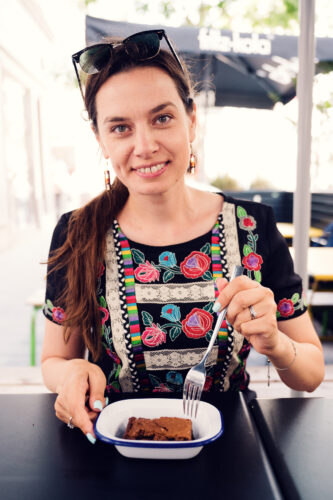 Adriana enjoying chocolate brownie dessert at XO Grill Neubaugasse.