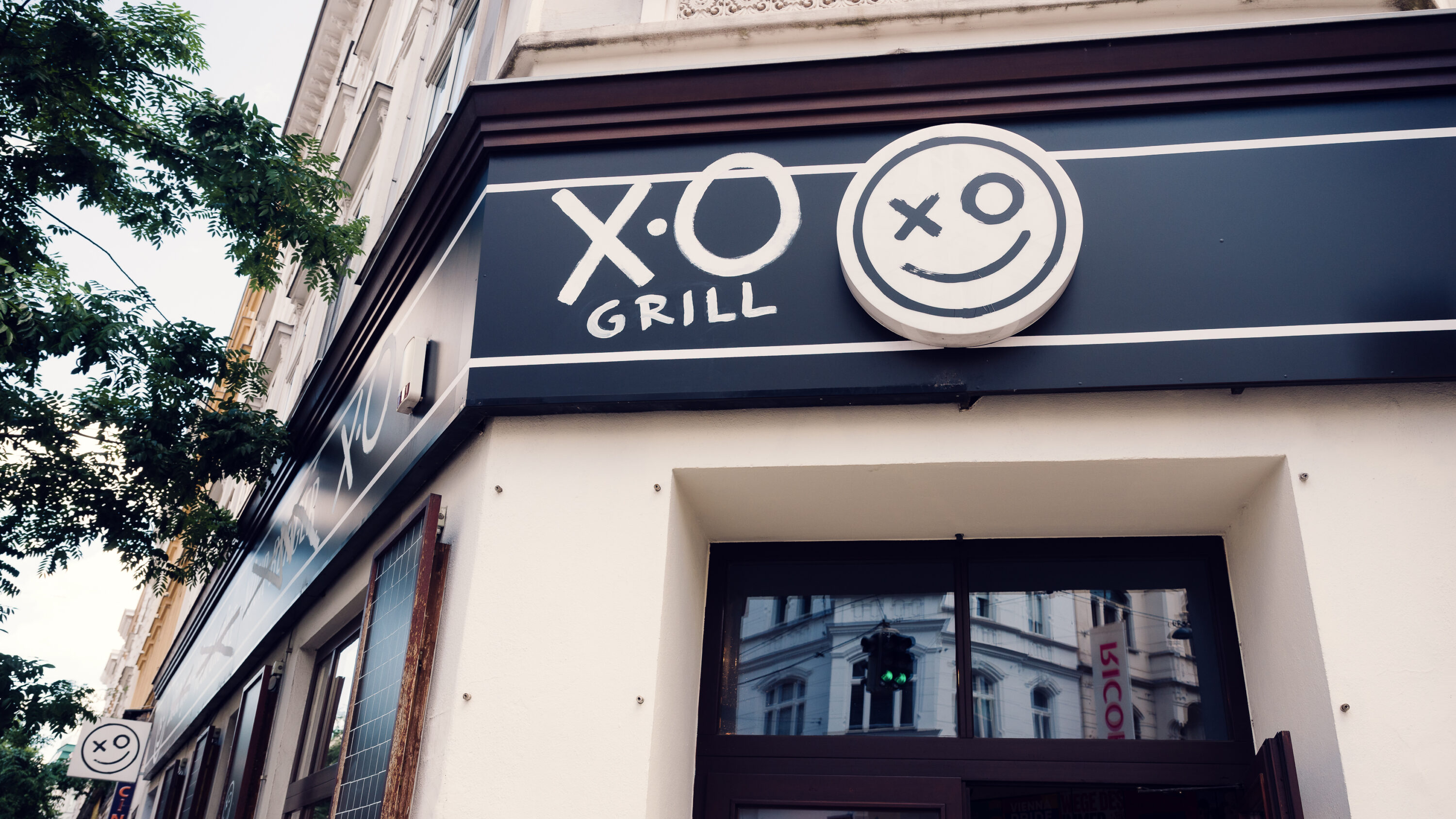 XO Grill Neubaugasse restaurant logo and branding elements.