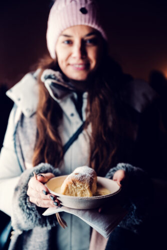Adriana with traditional Austrian Buchteln at Schönbrunn Christmas Market.