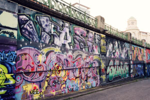 Donaukanal with colorful street art and graffiti murals.