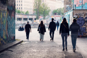 Donaukanal promenade with pedestrians.