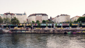 Colorful graffiti art on Donaukanal retaining walls.