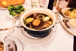 Traditional Tafelspitz boiled beef dish with root vegetables and horseradish sauce at Figlmüller Wollzeile.